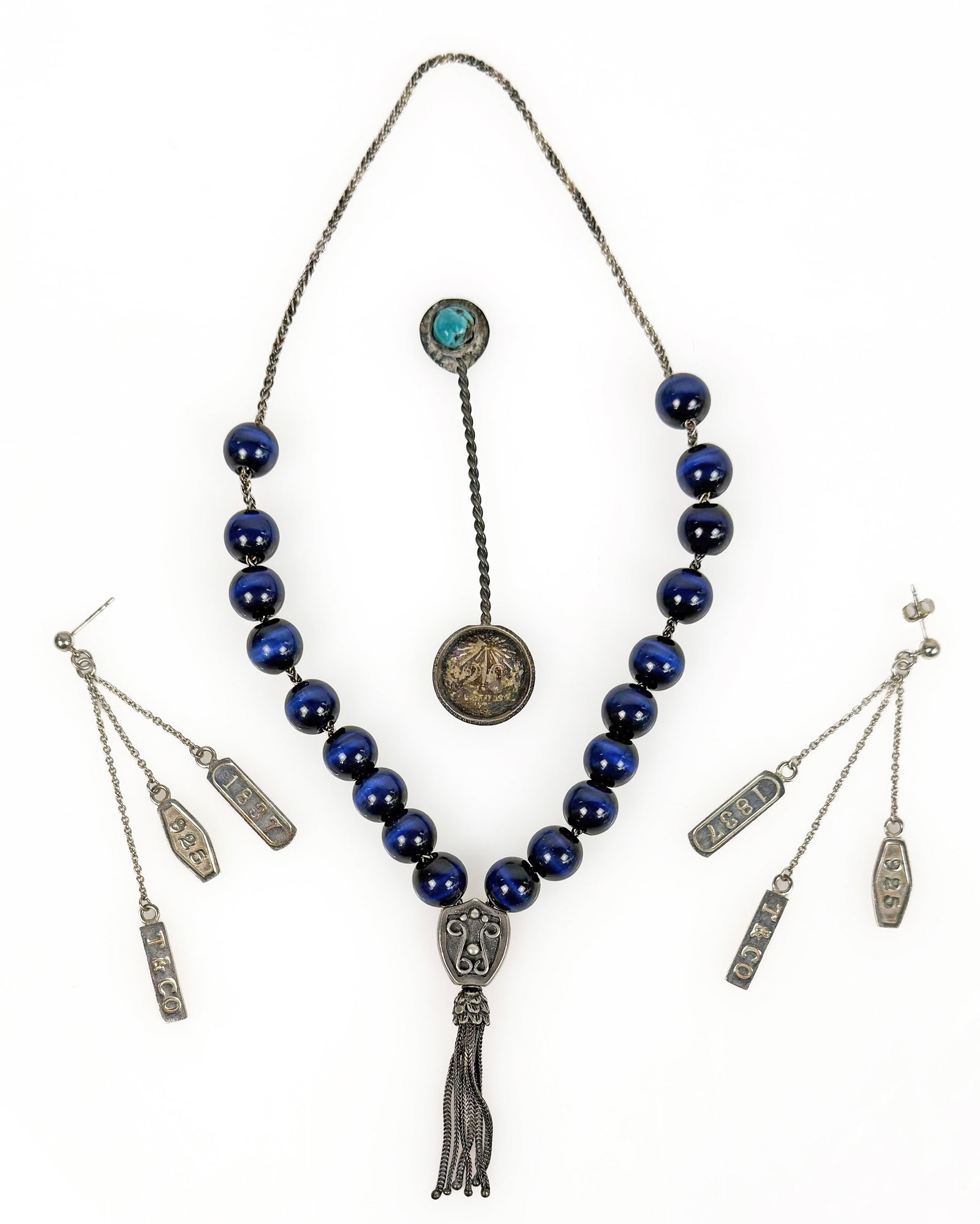 3 Sterling Items - Tiffany Earrings, Prayer, Spoon: The lot contains 3 pieces of sterling silver items. There is a pair of Tiffany & Co. 1837 triple bar dangle earrings, a set of Islamic prayer beads with 21 blue tiger eye beads, and a Mexican miniatur