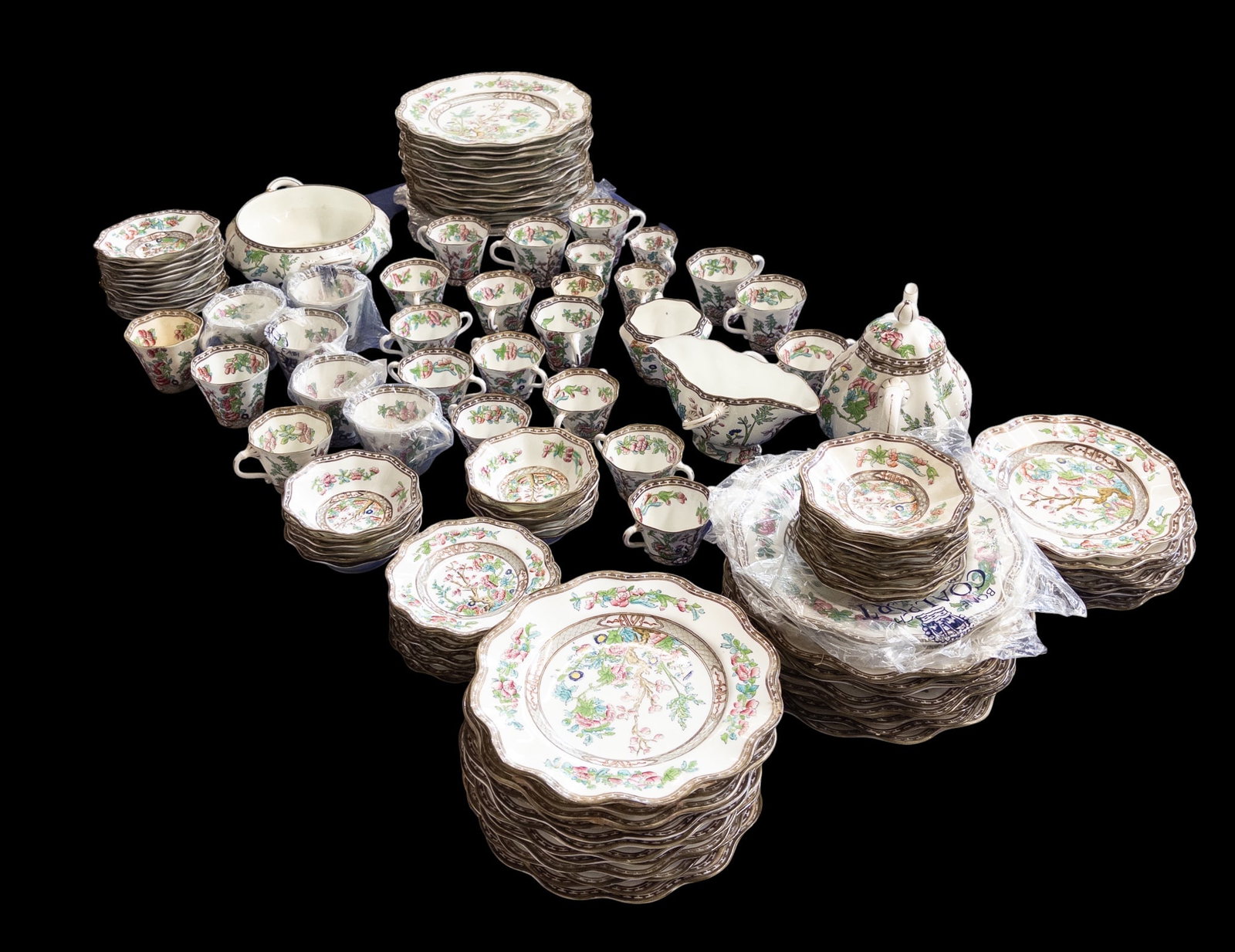 Coalport England "Indian Tree" China Service.: The lot contains 121 pieces of china. They are stamped Coalport England Leadless Glaze on the undersides. There are 14 dinner plates, 12 salad plates, 8 dessert plates, 12 soup bowls, 8 bread plates, 