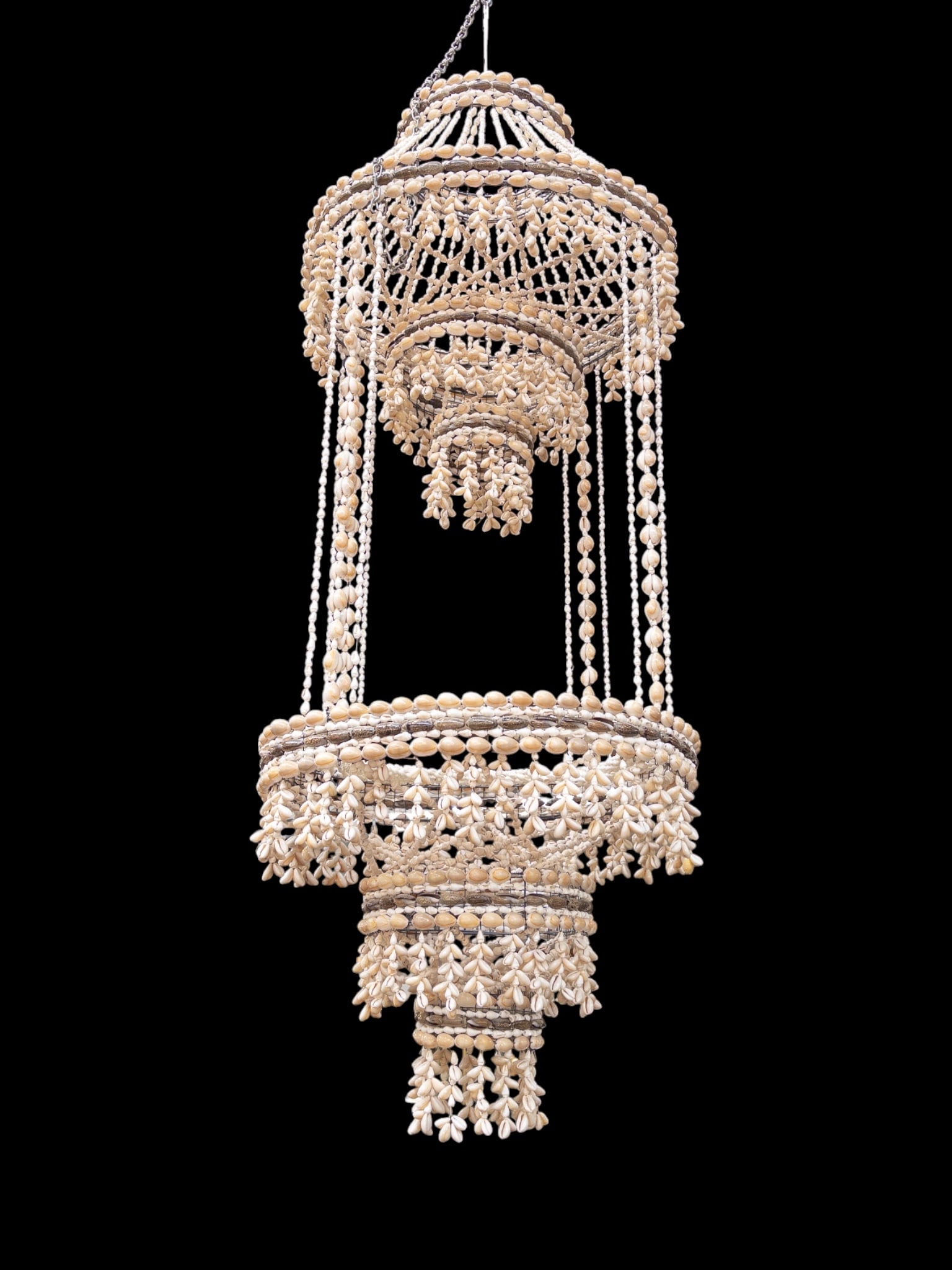Handcrafted Boho Seashell Hanging Planter.: The artisanal planter is composed of intricately strung sea shells and a wire frame. It can fit an 11" planter on the lower tier. The piece measures 42" long and 16" in maximum diameter (not including