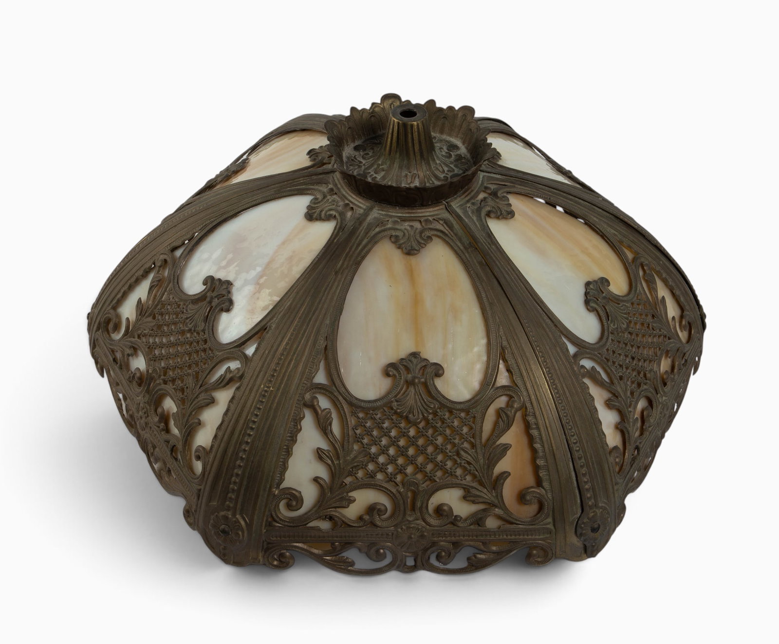 Antique Slag Glass Lamp Shade with Overlay.: The lamp shade features 6 beige slag glass panels with ornate cast metal overlay. It measures 9" tall and 18 3/4" in diameter. There are some scratches and stains on the metal. Otherwise, the lot is i