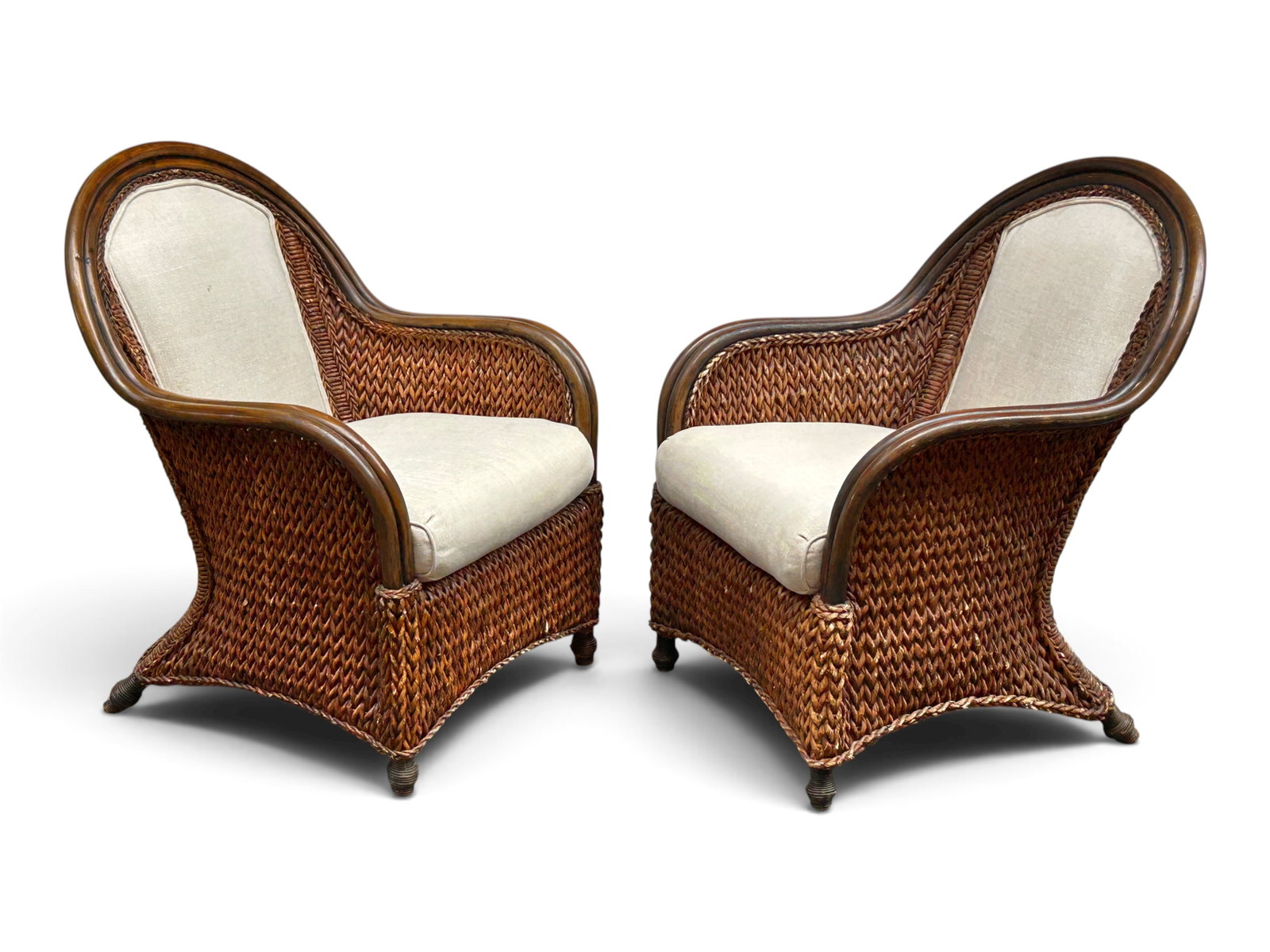 Pair of Woven Hyacinth Armchairs.: The vintage dark water hyacinth chairs have bentwood frames, a curved back and arms, and braided woven fibers. They have removable seat cushions and beige upholstery on the seats and back. They measur