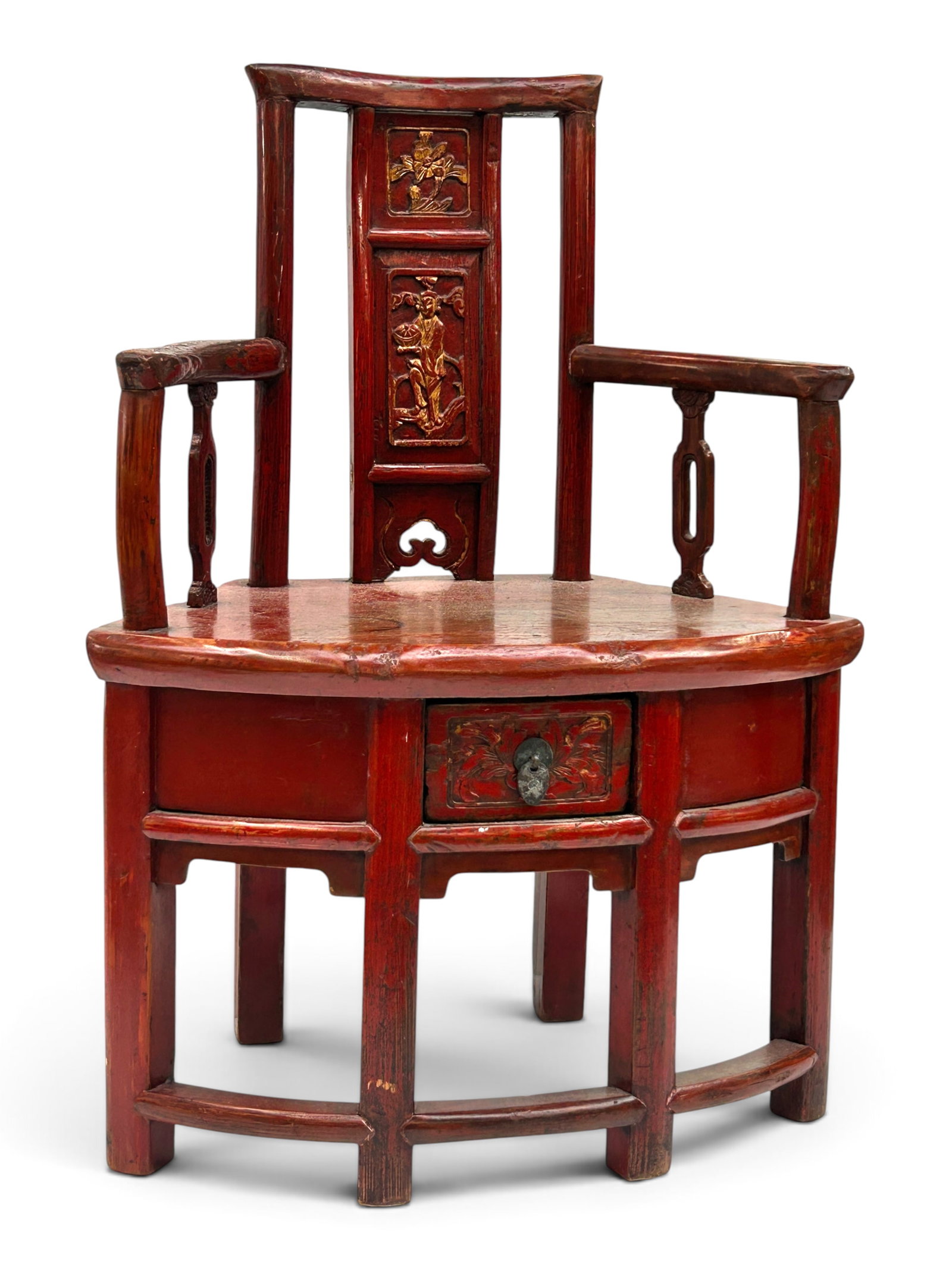 Small Painted Chinese Corner Chair w/ Drawer: The chair has pierced carved posts halfway down the arms, a carved relief figure and flowers on the back, and carved flowers on the drawer. The chair is finished in red lacquer and has faded gilt deta