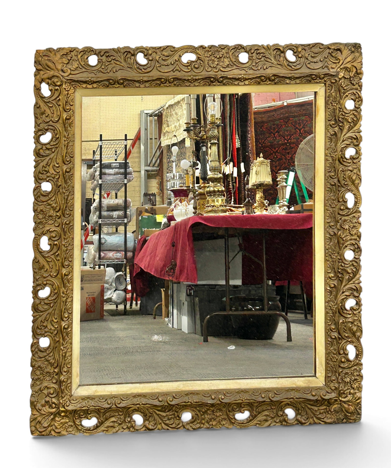 Ornate Victorian Gilded Mirror, As Is.: The mirror has a cream toned velvet lined border, and a rectangular pierced, molded, and gilded frame, featuring flower and scroll designs. The mirror measures 41 3/4" x 36 1/4". There are some chips