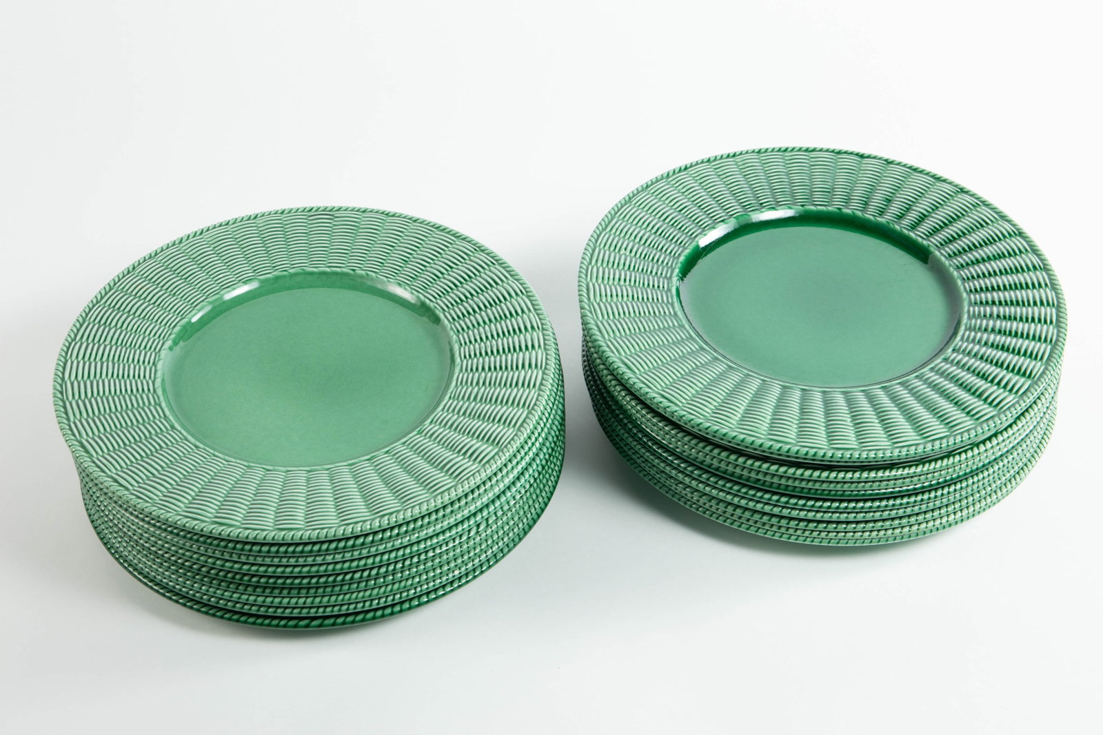 Este Italy Green Porcelain Basket Weave Plates.: These are large plates, each one measuring 12 7/8" x 12 7/8" x 7/8". There are a total of 19. A few have chips, but overall, the lot presents well. In-house shipping is available. To receive the best