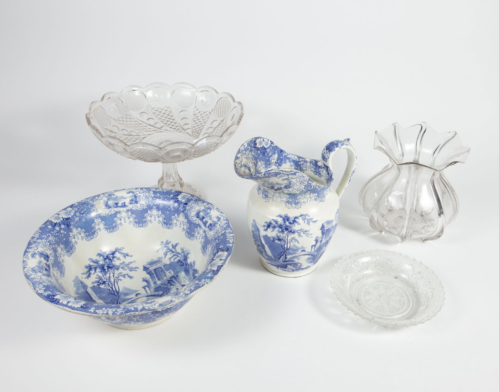 Lot: Transferware Dishes, EAPG, including Flint.: The large compote is a flint glass "Horn of Plenty" piece, with a small chip on the bottom. The bag-shaped vase also has a (larger) chip, and the pattern glass bowl has a small chip on the rim. The tr