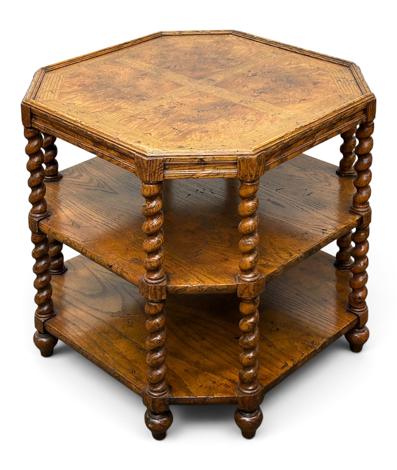 Baker Jacobean Style Octagonal Lamp Table.: The table has three tiers, a parquetry top, and barley twist columns. It is unsigned. There is some minor wear, but overall, the table is in good condition. It measures 26" wide, 26" deep, and 25"