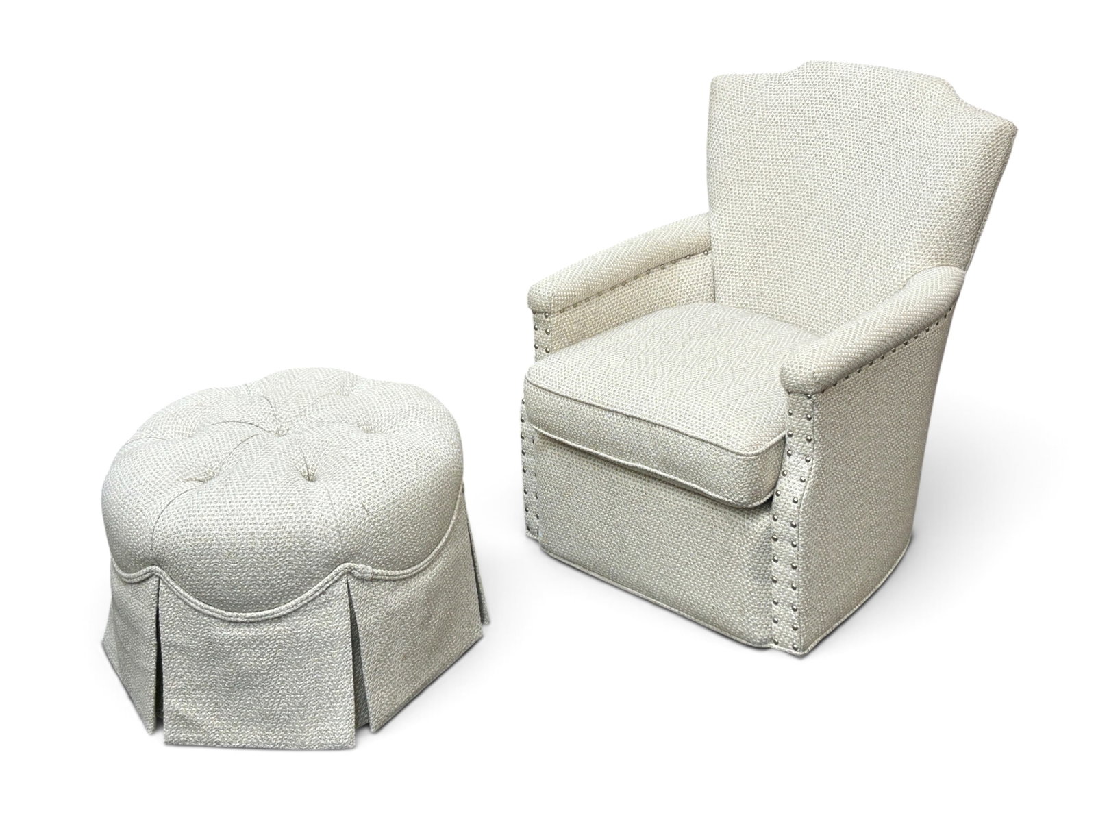 CR Laine Upholstered Swivel Armchair & Ottoman.: This signed chair has a swivel base and nailhead trim. The circular ottoman is button tufted. Both pieces are in great condition. The chair measures 28" wide, 30" deep, and 34" tall. The ottoman measu