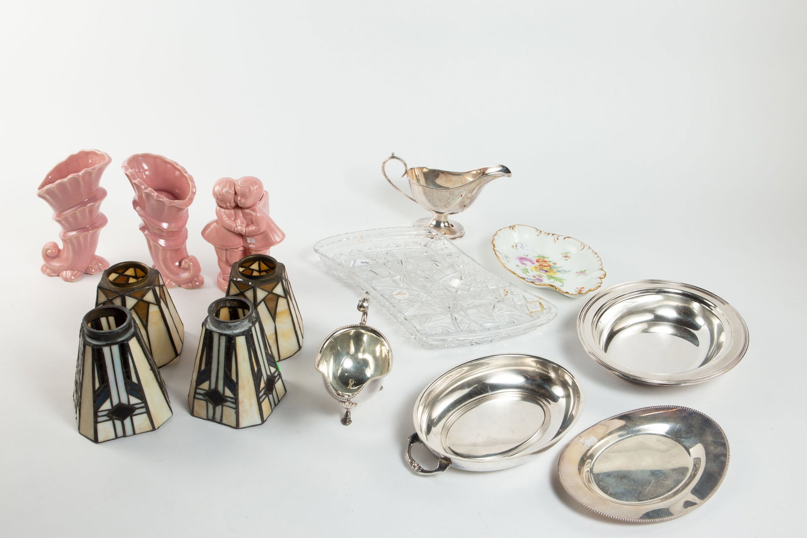 Lot: Cornucopia Vases, Stained Glass Shades, etc.: This lot includes three pink pottery pieces (matching cornucopia vases and a boy and girl vase), silverplate serving dishes, and more. Overall, the lot presents well. The largest item measures 14" x 9