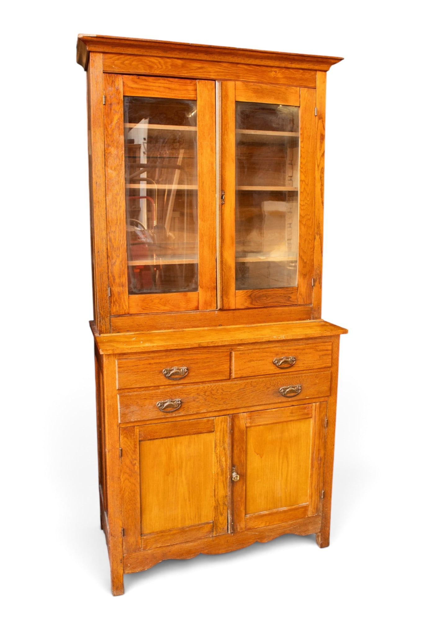 Primitive Stepback Cabinet.: The top section has lockable glass-front doors (no key included), with three adjustable shelves. The lower section has three drawers, and a set of doors with a fixed internal shelf. The bottoms of