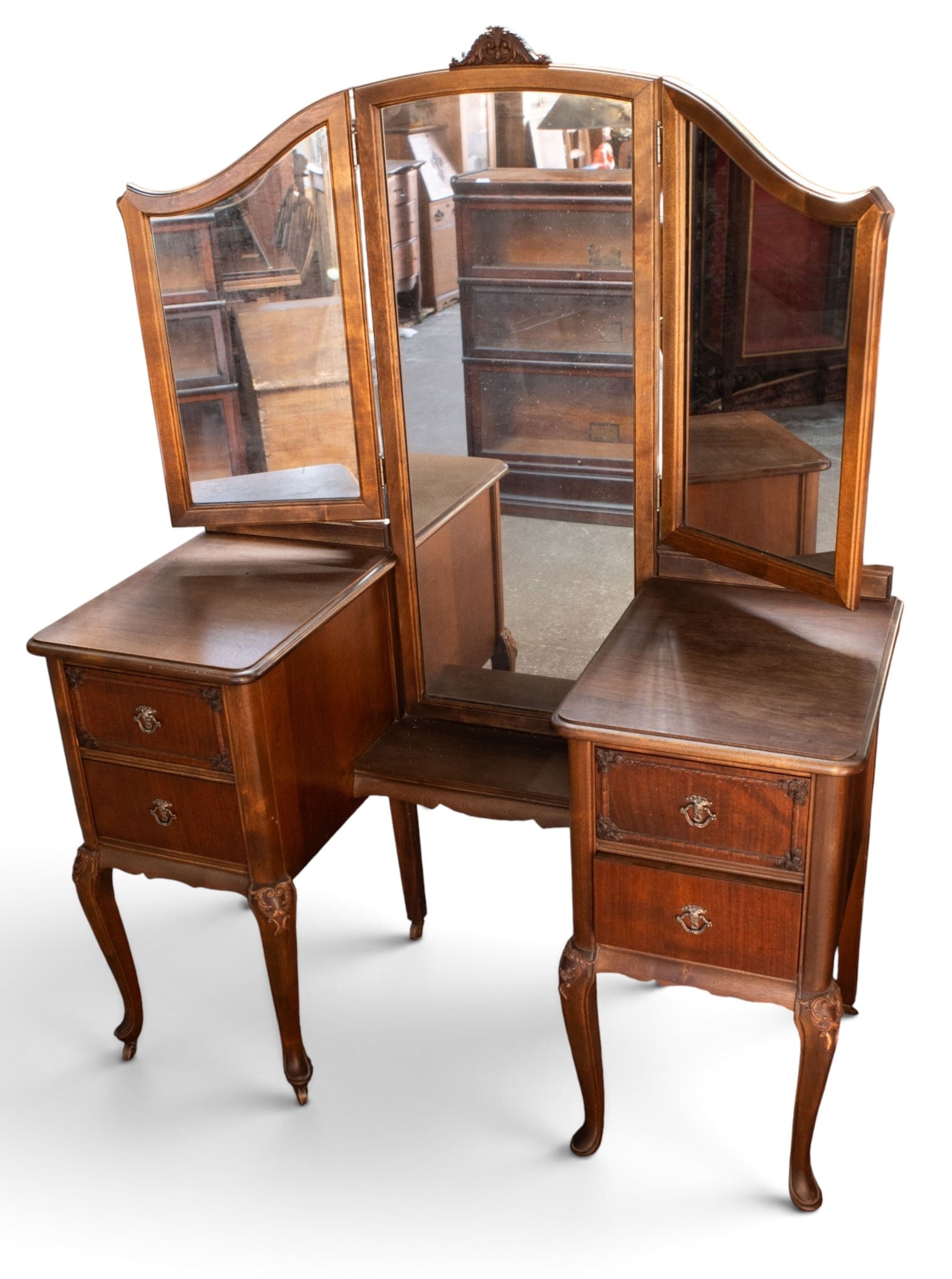 Vintage French Style Vanity.: This vanity has a trifold mirror, a small central shelf, and two sets of drawers with brass pulls on each side. It sits on cabriole legs with casters. The piece measures 48" wide, 20" deep, and 63"