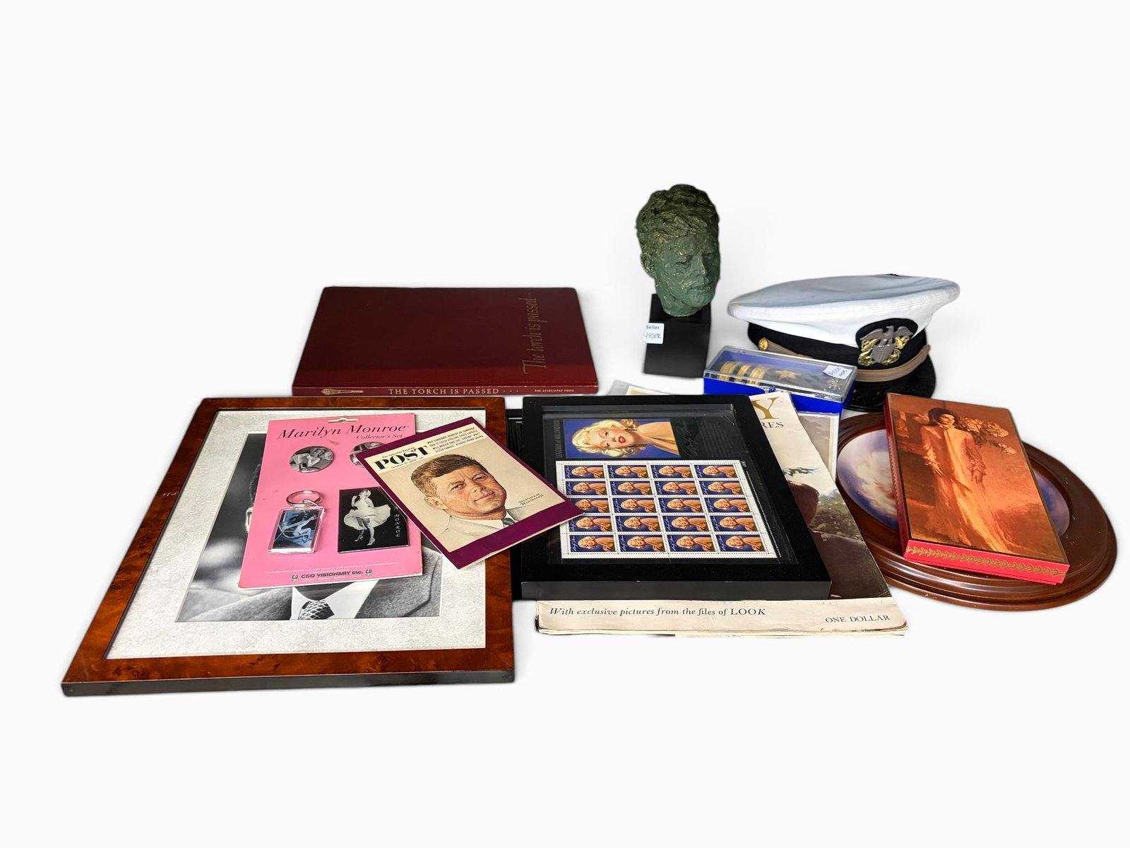 Lot: Marilyn Monroe, JFK, Jackie Kennedy Items.: This lot includes items related to Marilyn Monroe (pictures, decor), John F. Kennedy (bust statue, photo, book), and Jackie Kennedy (porcelain dish). Also included is a framed portrait of Abraham Linc