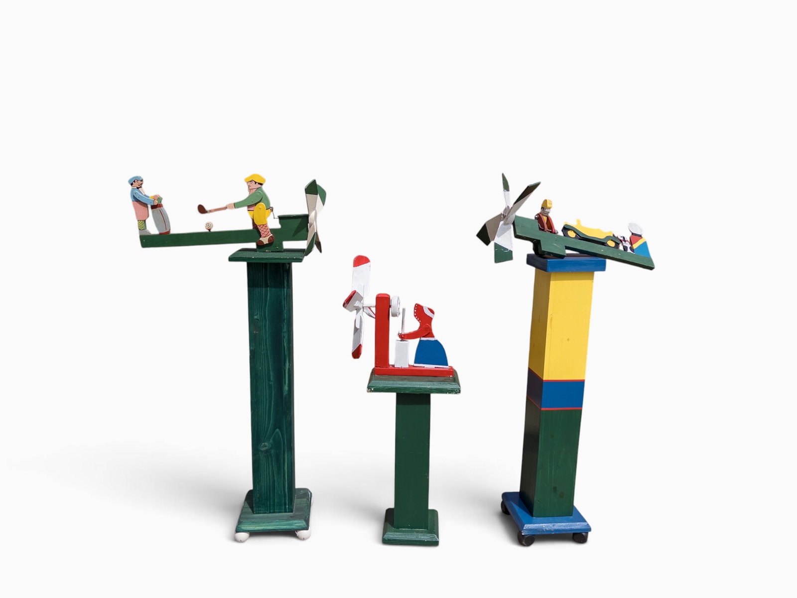 Lot of 3 Painted Folk Art Whirligigs.: One needs to be reattached to its base. The largest one in the lot measures 23 1/2" x 11" x 50 1/4". The smallest whirlygig measures 8 1/4" x 14 1/2" x 39 1/2". Third-party freight shipping or persona