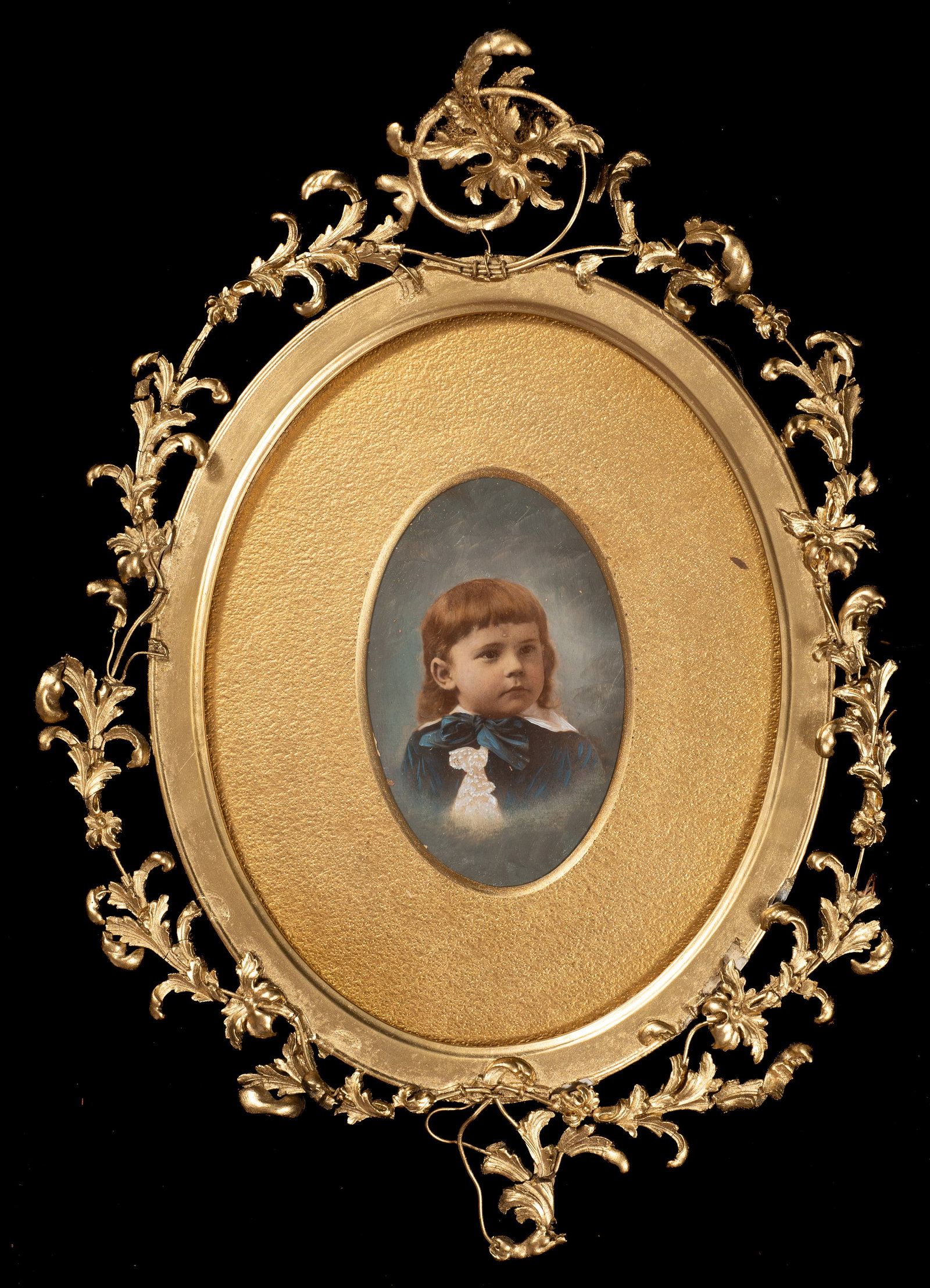 Hand Tinted Victorian Portrait of a Child.: This lot contains a Victorian hand tinted photograph of a child. Paperwork/Provenance: N/A Condition: The frame shows losses and repairs. The image is not properly housed in its frame, and the back