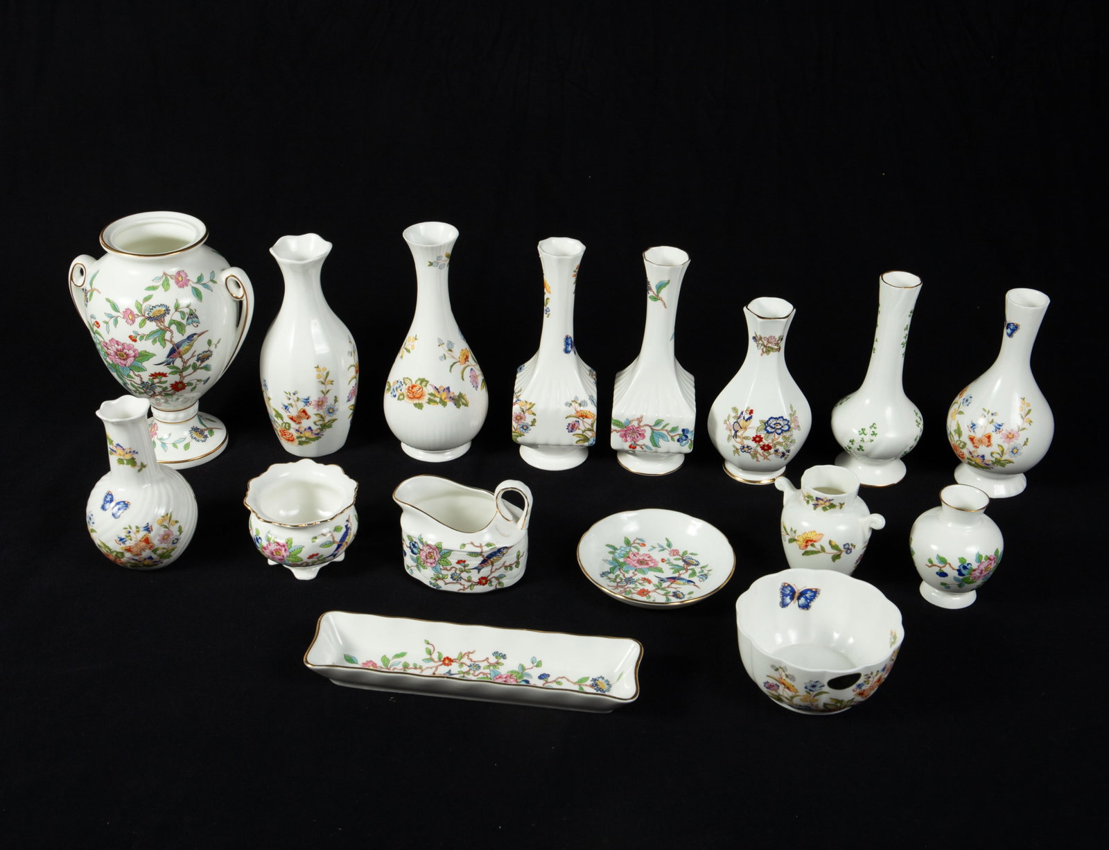 16 Pcs. Aynsley Bone China - Vases & More.: The lot contains 10 vases, an urn jar without a lid, 3 trinket bowls, and a rectangular tray. The designs included are Cottage Garden and Pembroke. The largest item measures 7 1/4" x 5 3/4" x 4 3/4",