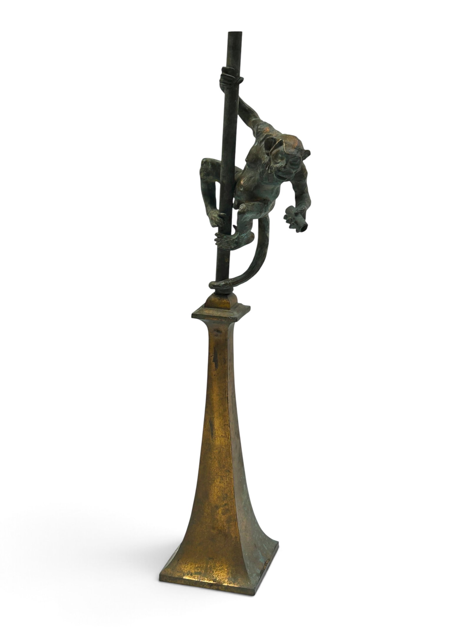 Obscure Bronze Climbing Monkey Sculpture.: The heavy Hollywood Regency style decorative item depicts a monkey climbing a post atop a tapered base which may be brass. The monkey, which is attached to the pole it is climbing, is not attached to