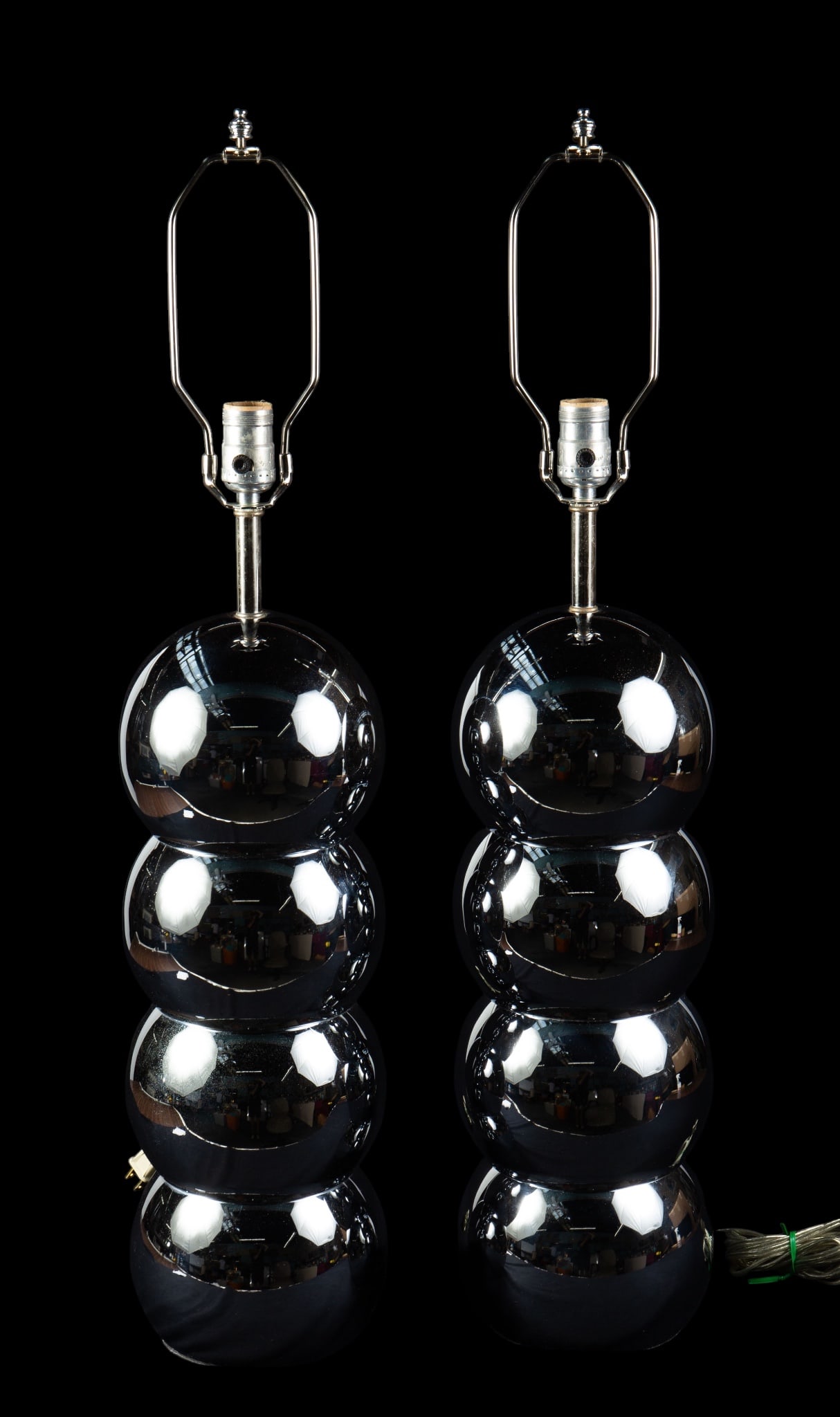 Pair of George Kovac Chrome Lamps.: The lot consists of a pair of mid century chrome stacked ball table lamps by George Kovac. They measure 32 1/2" tall and 6 3/4" in diameter. There are some scratches and stains on the pair. Otherwise,