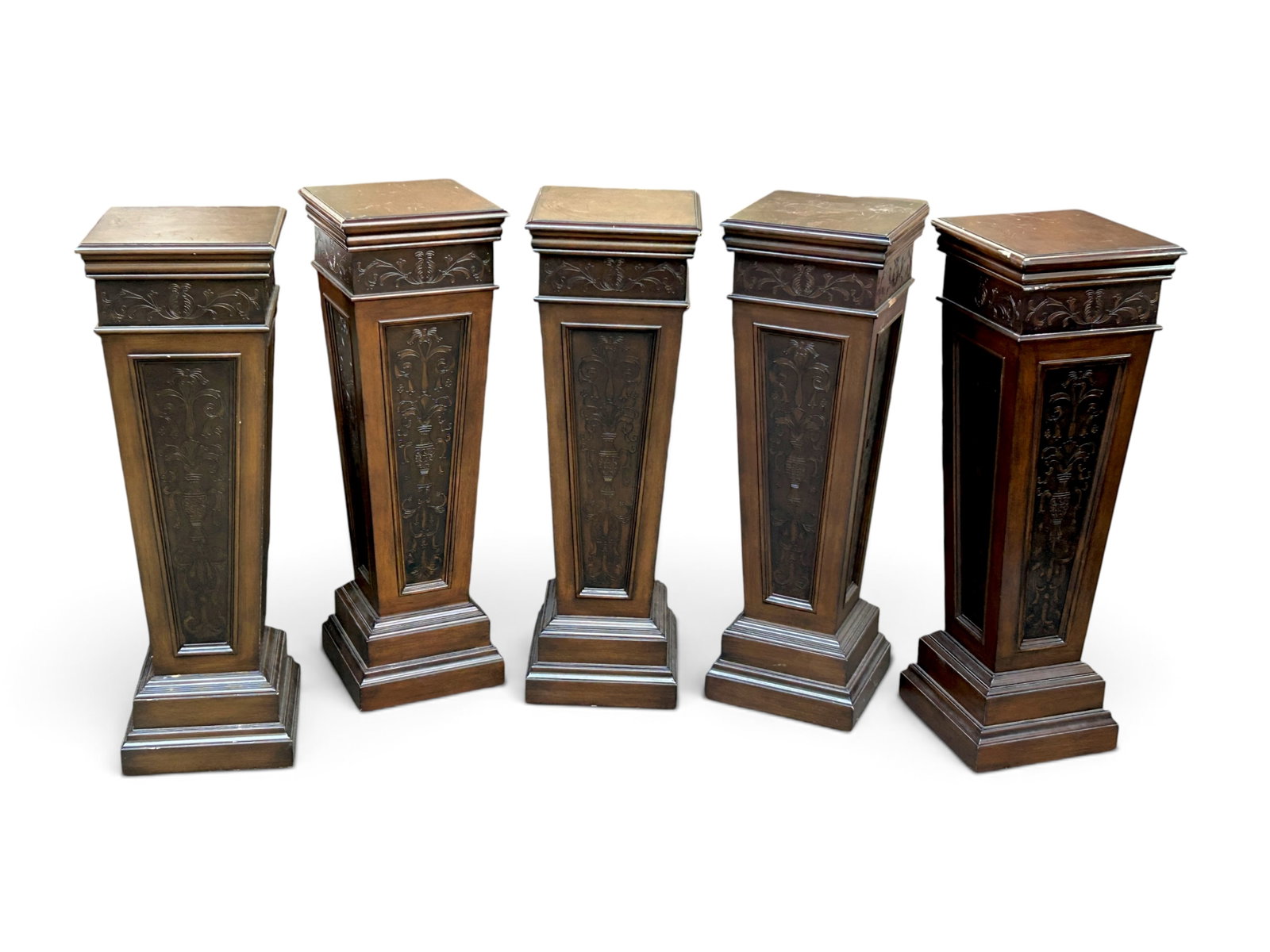 Five Contemporary Mahogany Pedestals.: The pedestals are by Home Meridian Furniture. They have faux metal inlay, bevelled tops, and panels. They are in fair overall condition with some indentations and scuff marks. Each one measures 14"