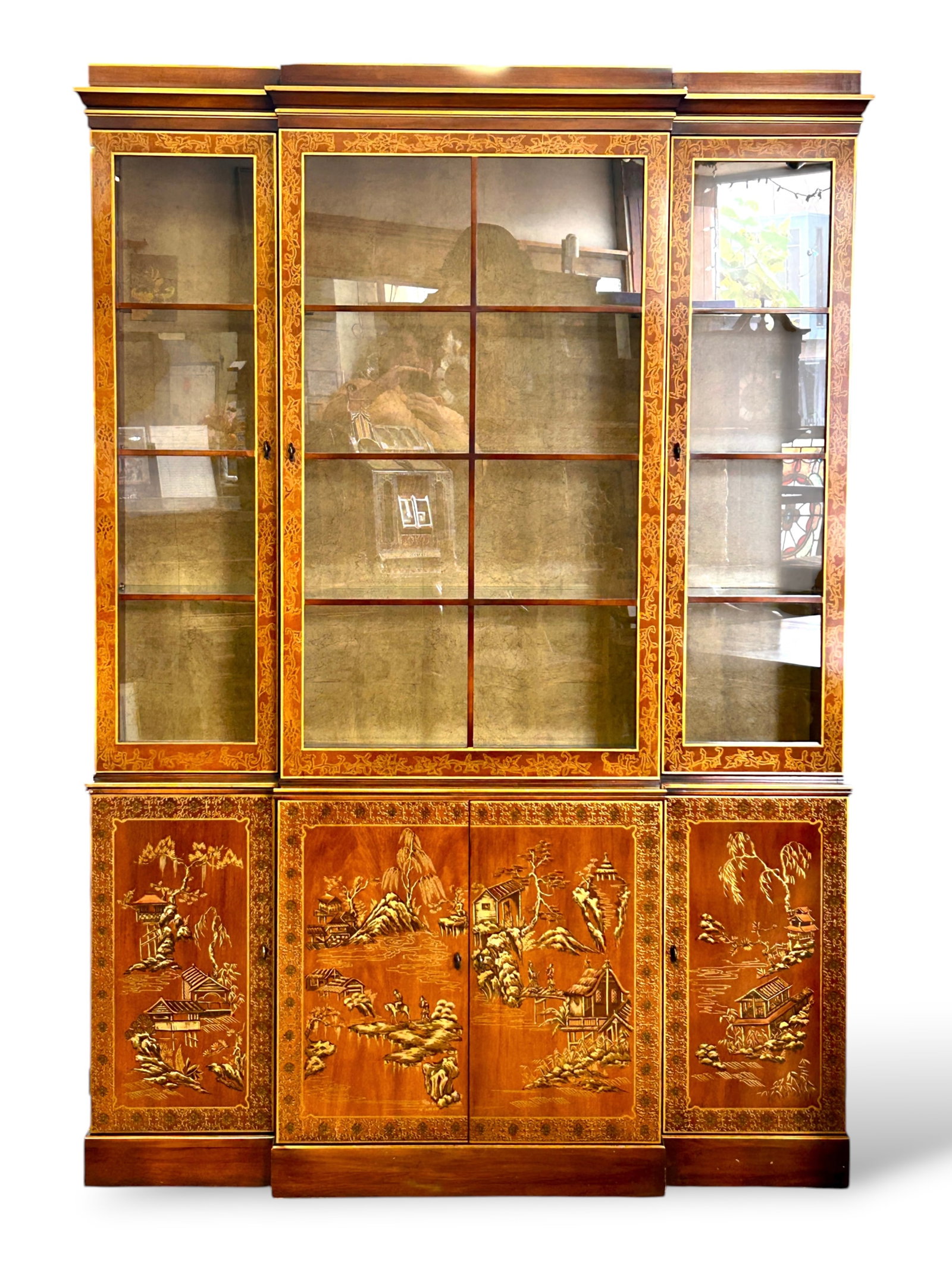 Drexel Heritage Chinoiserie Breakfront Cabinet.: The chinoiserie style breakfront china or display cabinet has 3 glass doors on the upper section, each with 3 adjustable glass shelves inside. The doors have wooden grids and ornate gilt painted