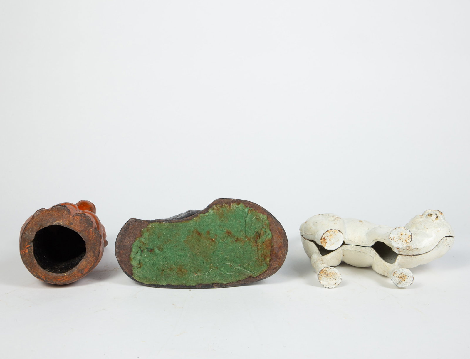 Lot of 4 Cast Iron Cat Doorstops.: They appear to be unmarked. The lot includes a painted Hubley? white cat with a raised tail, an orange kitten, a black cat with green eyes, and a seated black cat. There are some signs of age-related 