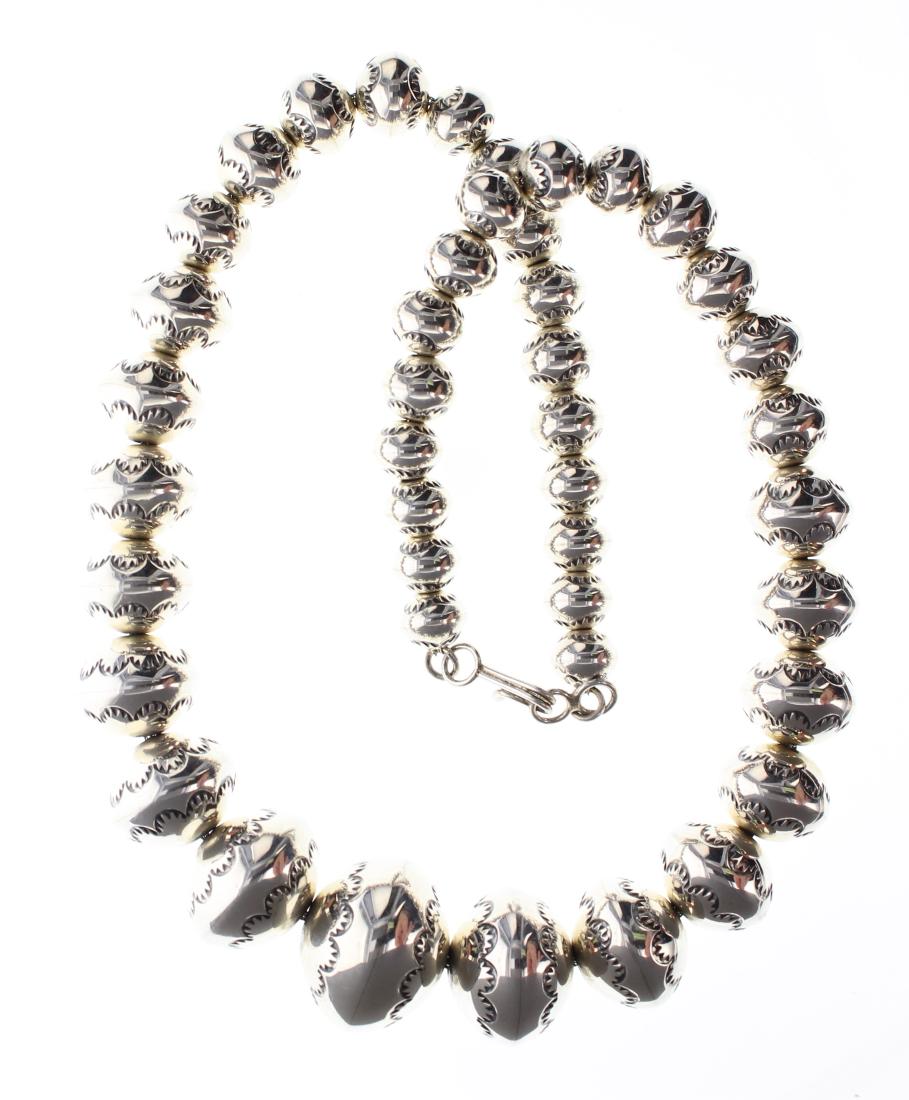 Sterling Silver Larry Pinto Roundel Graduated Bench: Sterling Silver Larry Pinto Roundel Graduated Bench Beads Necklace Navajo Native American Southwest Indian Jewelry ||| Weight: 94.9 Grams, Dimensions: Necklace: 19" length, bead diameters range from 9