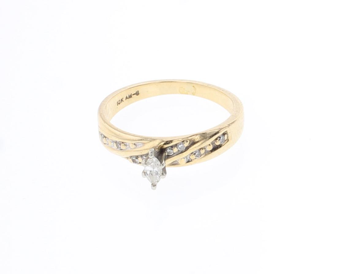 Vintage 10K Gold & Diamond Ring: 10K Gold | Diamonds | Vintage 10K Gold & Diamond Ring | Gold & Diamond Estate Collection | Weight:2.7 Grams, | Dimensions: Ring: 7 size, .25" face width, 2mm x 5mm stone |