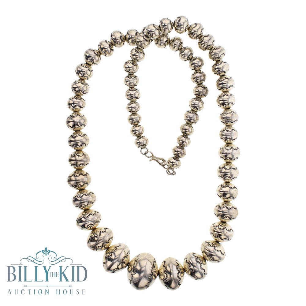 Larry Pinto Graduated Stamp Beads Necklace: Sterling Silver | | Larry Pinto Graduated Stamp Beads Necklace | Navajo Native American Southwest Indian Jewelry | Weight:121.9 Grams, | Dimensions: Necklace: 23" length, 10mm - 20mm beads |