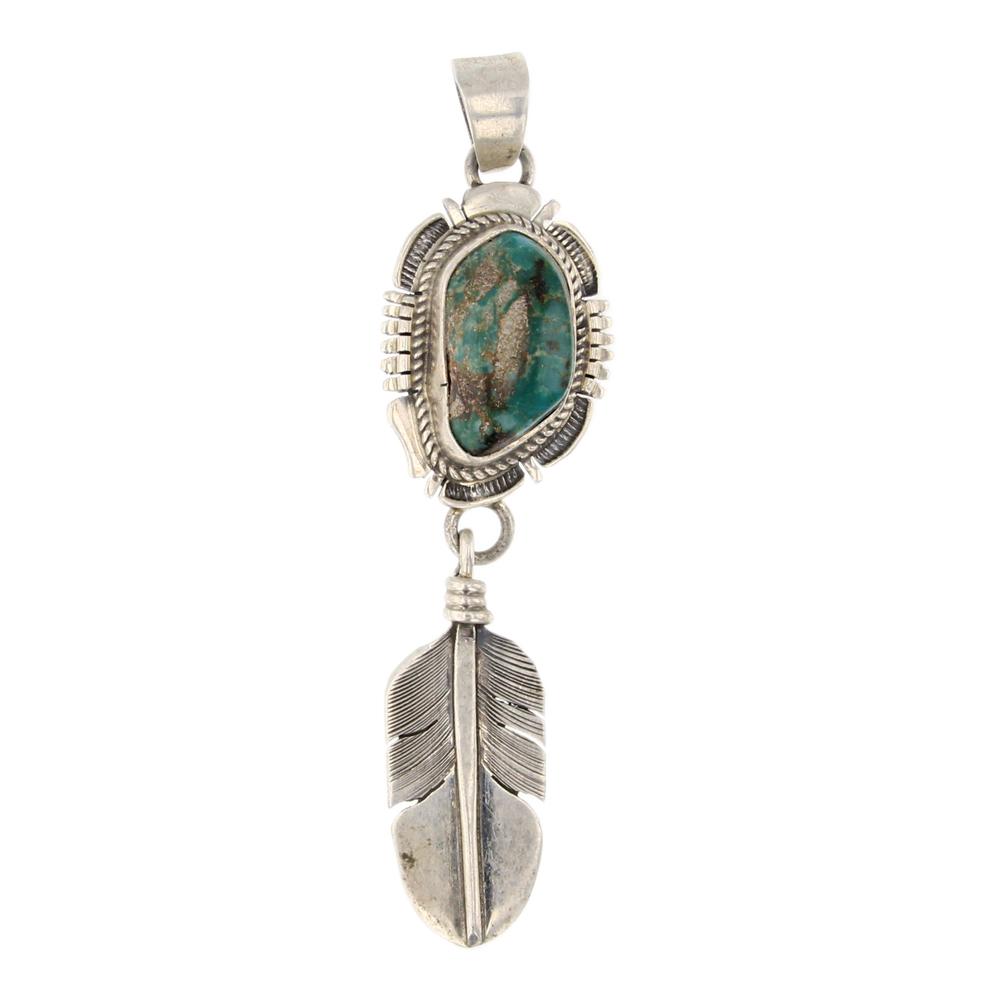 Bennie Ration Nevada Turquoise Pendant: Sterling Silver | Genuine Nevada Turquoise | Bennie Ration Nevada Turquoise Pendant | Navajo Native American Southwest Indian Jewelry | Approximate Weight: 12 Grams | Dimensions: Pendant: .75" x 3" |