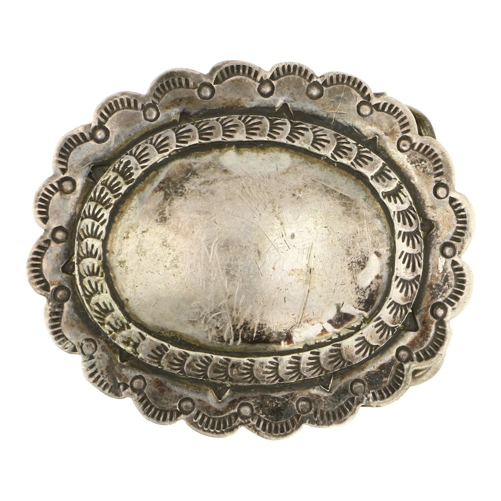 Vintage Navajo Plain Silver Stamp Belt Buckle: Sterling Silver | | Vintage Navajo Plain Silver Stamp Belt Buckle | Navajo Native American Southwest Indian Jewelry | Approximate Weight: 19 Grams | Dimensions: Buckle: 2.25" x 2" | Signed: Jolynn Dot