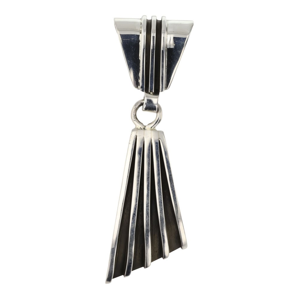 Tom Hawk Navajo Plain Silver Pendant: Sterling Silver | | Tom Hawk Navajo Plain Silver Pendant | Navajo Native American Southwest Indian Jewelry | Good (no breaks or damages) | Approximate Weight: 23 Grams | Pendant: 1" x 3.5" Signed: | T