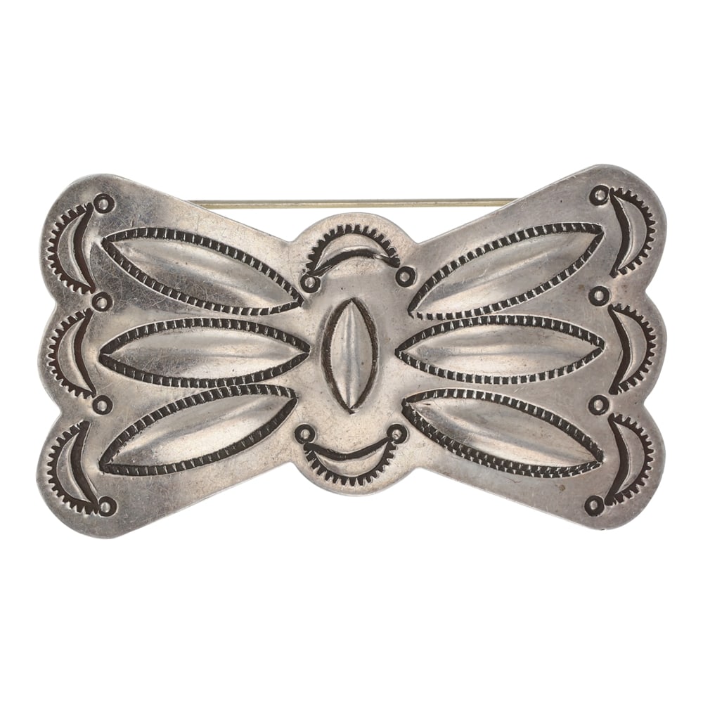 Vintage Navajo Sterling Silver Stamp Work Pin: Sterling Silver | | Vintage Navajo Sterling Silver Stamp Work Pin | Navajo Native American Southwest Indian Jewelry | Good (no breaks or damages) | Approximate Weight: 10 Grams | Pin: 2.25" x 1.25" |