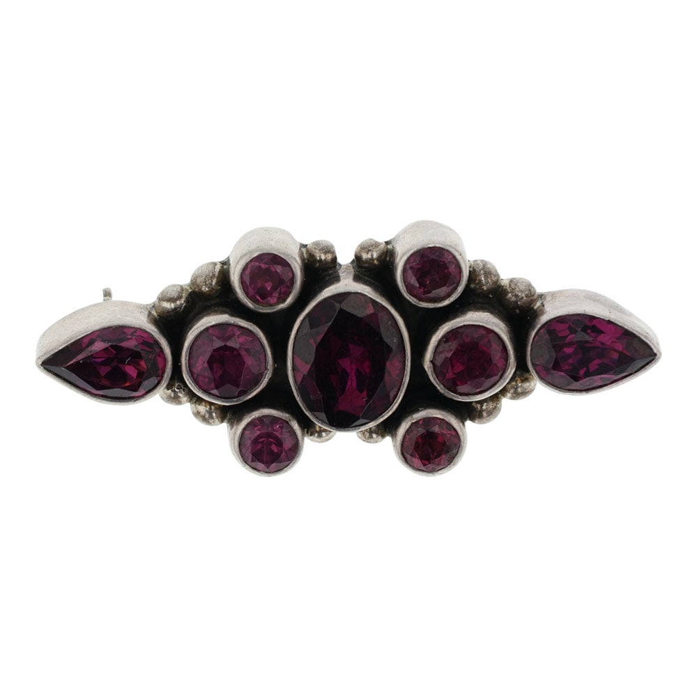 Ann Curley Navajo Faceted Garnet Pin: Sterling Silver | Genuine Faceted Garnet | Ann Curley Navajo Faceted Garnet Pin | Navajo Native American Southwest Indian Jewelry | Good (no breaks or damages) | Approximate Weight: 8 Grams | Pin: .75