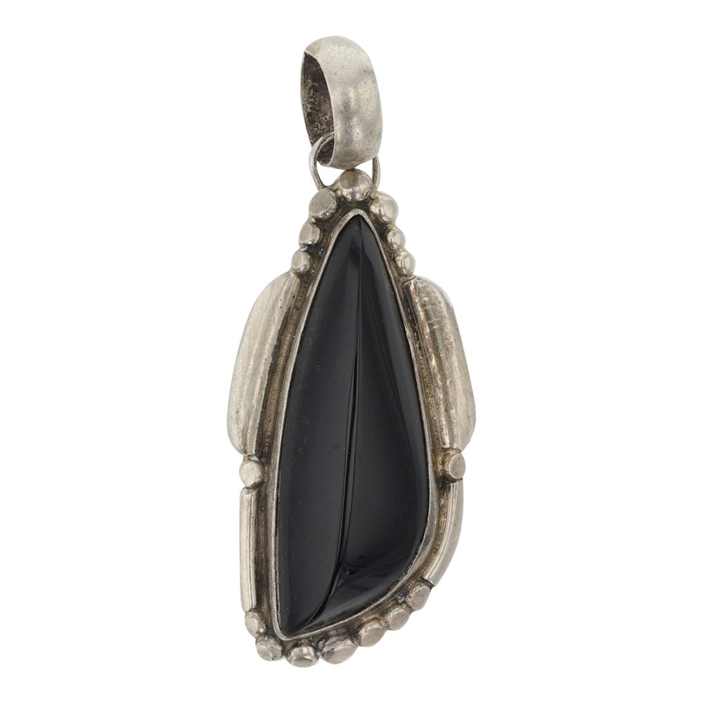 Navajo Freeform Black Onyx Pendant: Sterling Silver | Genuine Black Onyx | Navajo Freeform Black Onyx Pendant | Navajo Native American Southwest Indian Jewelry | Good (no breaks or damages) | Approximate Weight: 11 Grams | Pendant: .75"