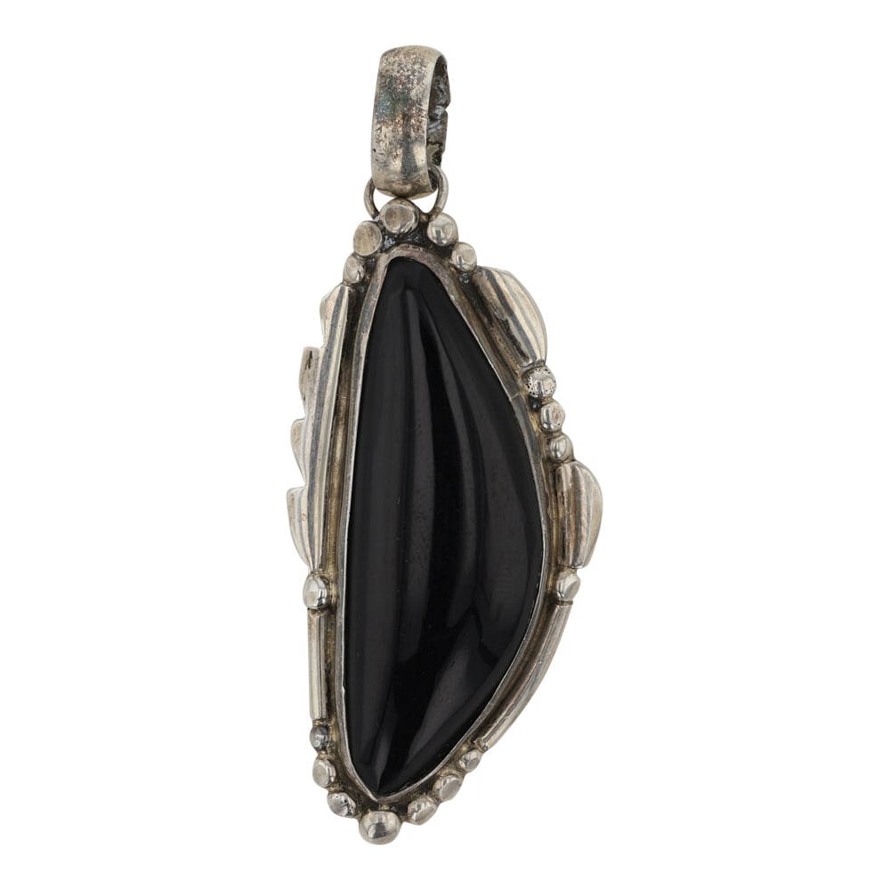 Navajo Black Onyx Freeform Pendant: Sterling Silver | Black Onyx | Navajo Black Onyx Freeform Pendant | Navajo Native American Southwest Indian Jewelry | Good (no breaks or damages) | Approximate Weight: 12 Grams | Pendant: 1" x 2.5" | 