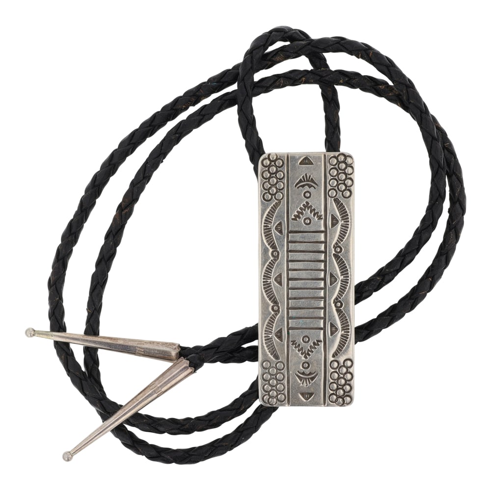 Clyde Aguilar Santo Domingo Stamp Work Bolo Tie: Sterling Silver | | Clyde Aguilar Santo Domingo Stamp Work Bolo Tie | Santo Domingo Pueblo Native American Southwest Indian Jewelry | Good (no breaks or damages) | Approximate Weight: 38 Grams | Bolo: