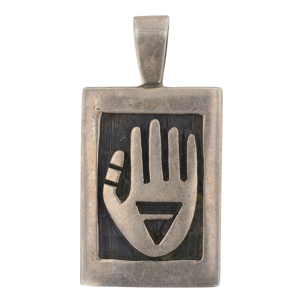 Benjamin Mansfield Hopi Pendant: Sterling Silver | | Benjamin Mansfield Hopi Pendant | Hopi Native American Southwest Indian Jewelry | Good (no breaks or damages) | Approximate Weight: 4 Grams | Pendant: 1.25" x .75" |