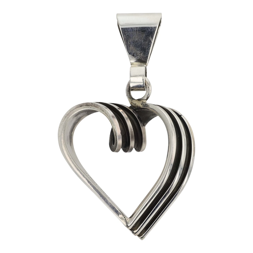 Tom Hawk Navajo Heart Pendant: Sterling Silver | | Tom Hawk Navajo Heart Pendant | Navajo Native American Southwest Indian Jewelry | Good (no breaks or damages) | Approximate Weight: 24 Grams | Pendant: 2.75" x 1.5" | Signed: Tom H