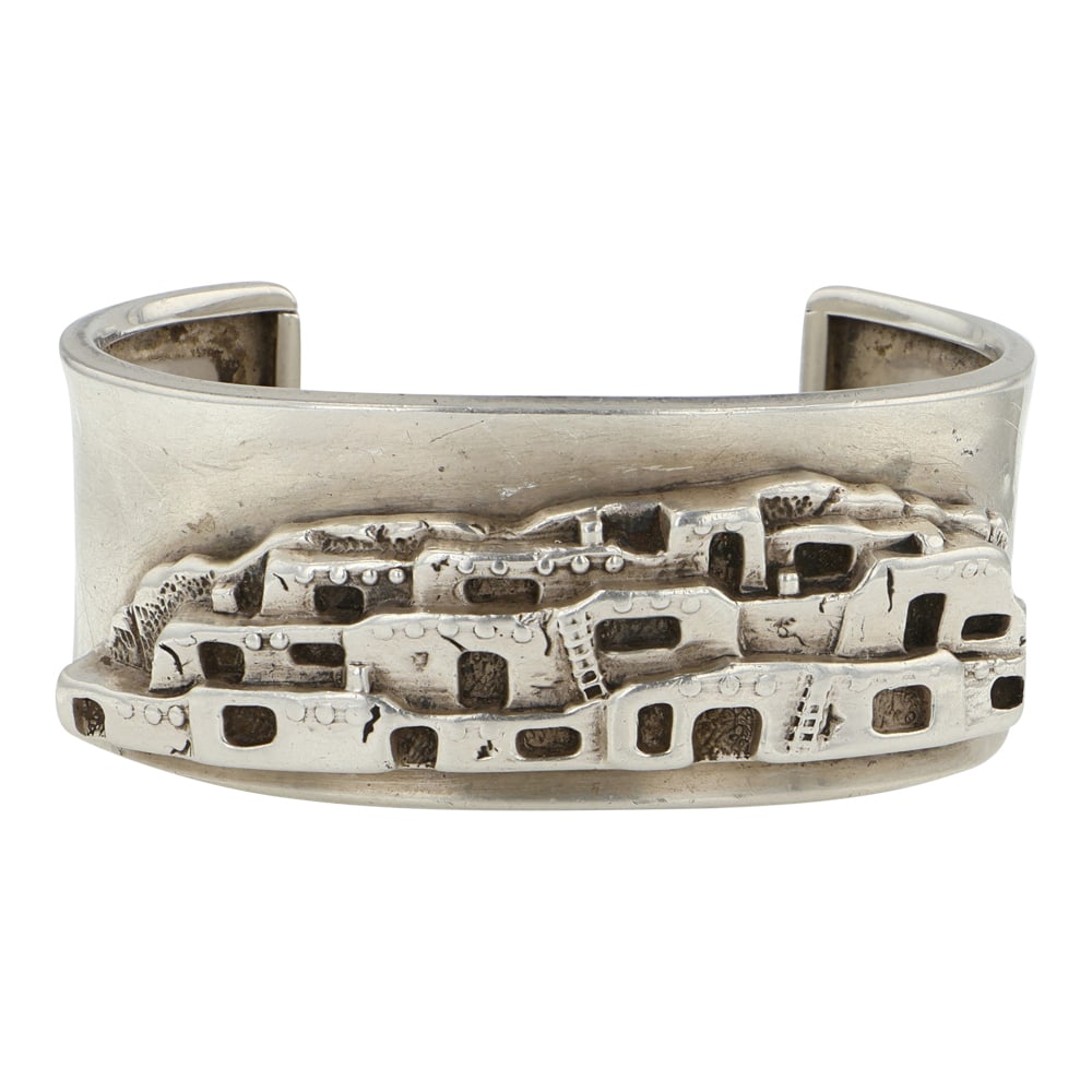 Navajo Cast Pueblos Plain Silver Bracelet: Sterling Silver | | Navajo Cast Pueblos Plain Silver Bracelet | Navajo Native American Southwest Indian Jewelry | Good (no breaks or damages) | Approximate Weight: 54 Grams | Bracelet: 5.25" inner, 1.