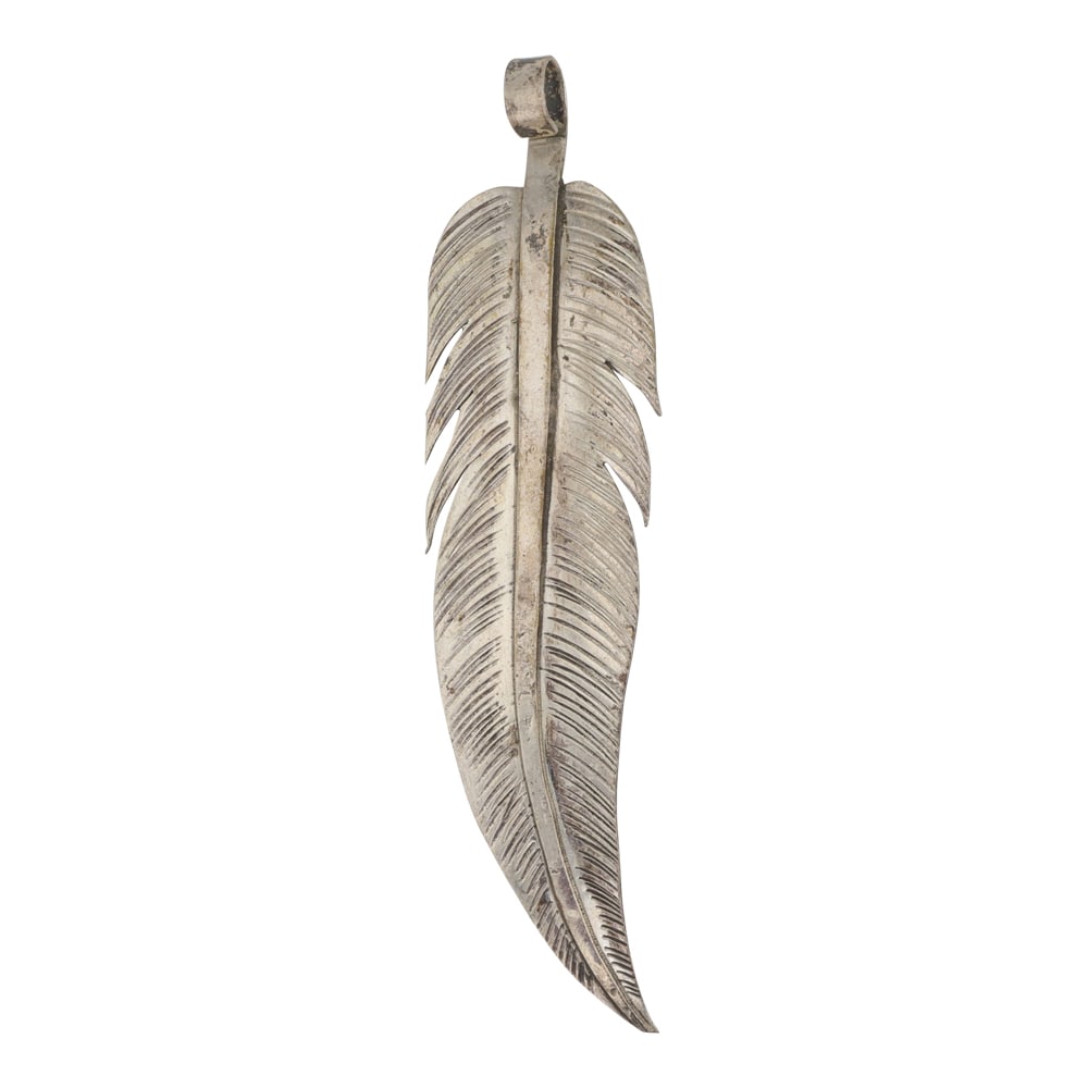 Vintage Navajo Plain Silver Feather Pendant: Sterling Silver | | Vintage Navajo Plain Silver Feather Pendant | Navajo Native American Southwest Indian Jewelry | Good (no breaks or damages) | Approximate Weight: 4 Grams | Pendant: 2.75" x .75" | 