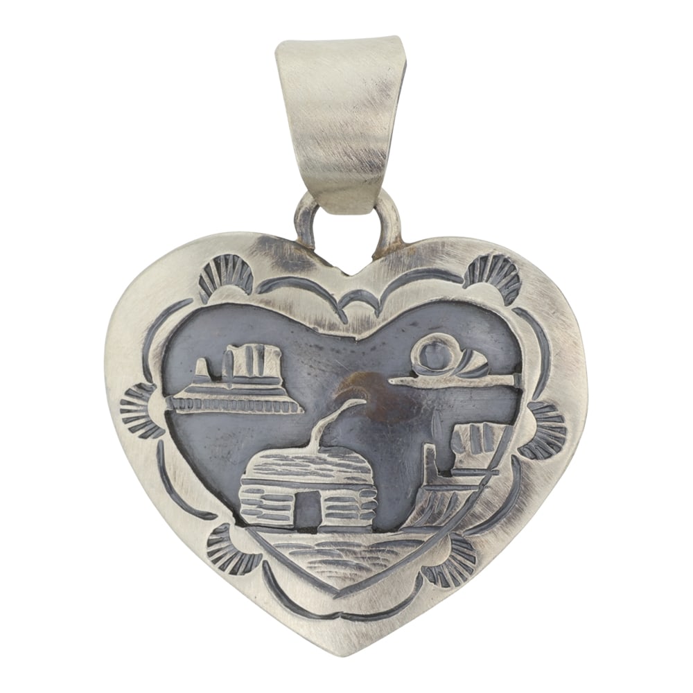 Navajo Plain Silver Story Teller Heart Pendant: Sterling Silver | | Navajo Plain Silver Story Teller Heart Pendant | Navajo Native American Southwest Indian Jewelry | Good (no breaks or damages) | Approximate Weight:?8?Grams | Pendant: 1.5" x 1" | 