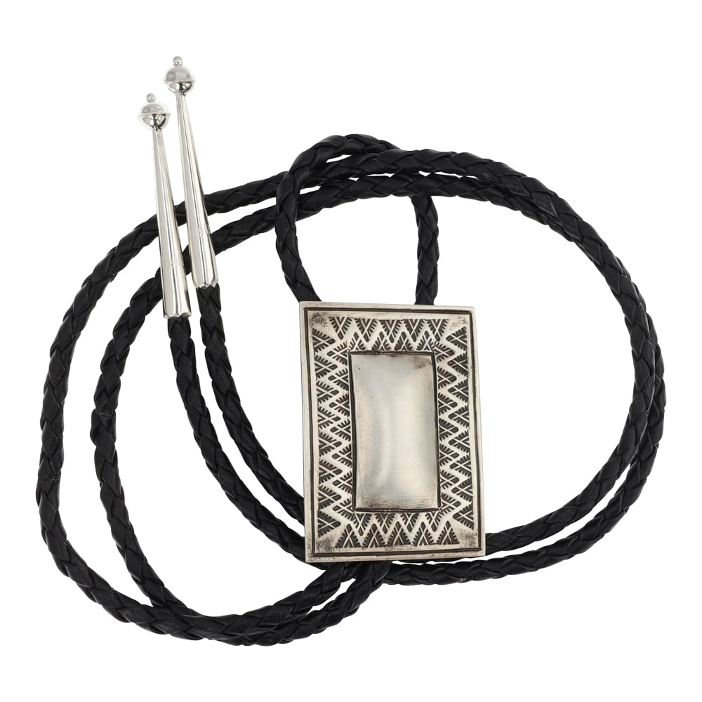 Vintage Navajo Stamp-Work Plain Silver Bolo Tie: Sterling Silver | | Vintage Navajo Stamp-Work Plain Silver Bolo Tie | Navajo Native American Southwest Indian Jewelry | Good (no breaks or damages) | Approximate Weight: 41 Grams | Bolo: 22" length,