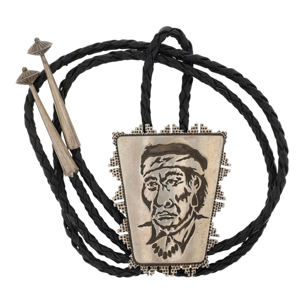 Vintage Navajo Portrait Bolo Tie: Sterling Silver | | Vintage Navajo Portrait Bolo Tie | Navajo Native American Southwest Indian Jewelry | Good (no breaks or damages) | Approximate Weight: 47 Grams | Bolo: 22" length, 2.5" x 2" pendan