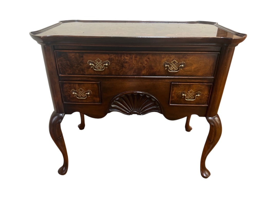 Vintage Knob Creek Carved Wood Console Table: This vintage console table from Knob Creek showcases an elegant design crafted in richly grained wood. Highlighted by its cabriole legs and ornate detailing, this piece embodies classic craftsmanship