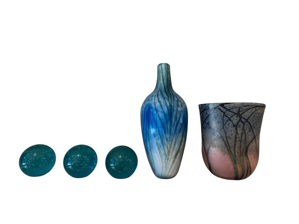 Group of five art glass decorative objects comprising three aqua-blue bubble-filled glass spheres, a: Group of five art glass decorative objects comprising three aqua-blue bubble-filled glass spheres, a tall pulled-neck blown-glass bottle with layered blue, green and white vertical streaking, and a la