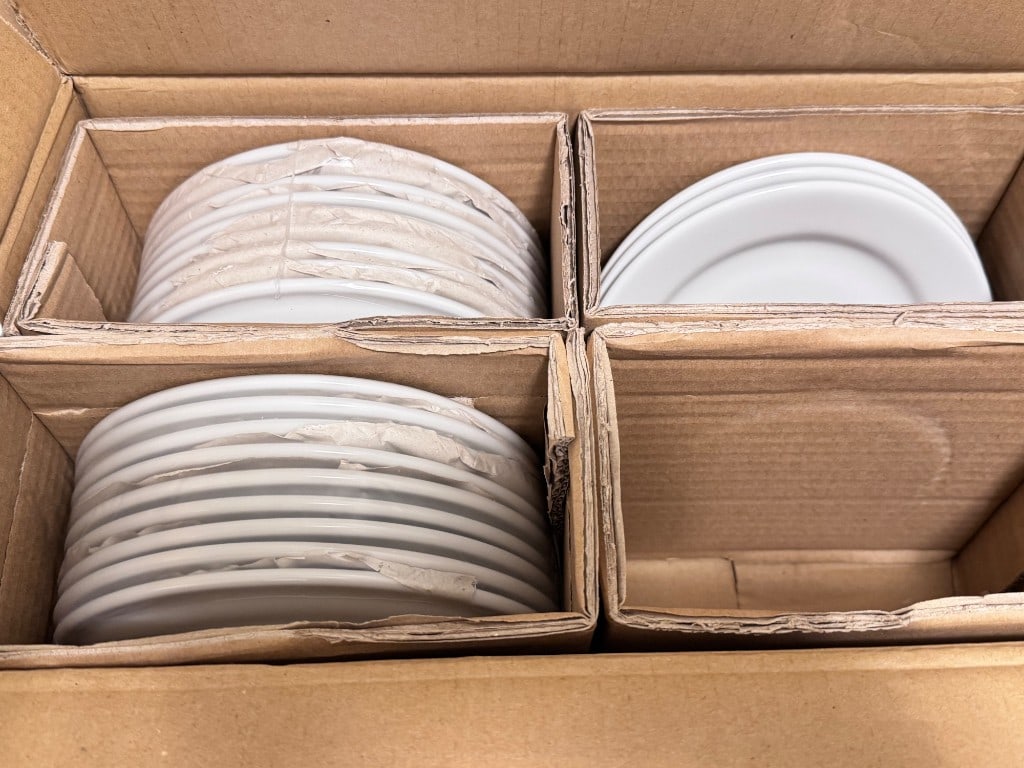 Tuxton porcelain dinner plates, identified on the manufacturerâ€™s carton as model ALA-074 (AC1A) an: Tuxton porcelain dinner plates, identified on the manufacturerâ€™s carton as model ALA-074 (AC1A) and marked 7 1/2" Porcelain White. Images show a quantity packed with cardboard dividers and pape