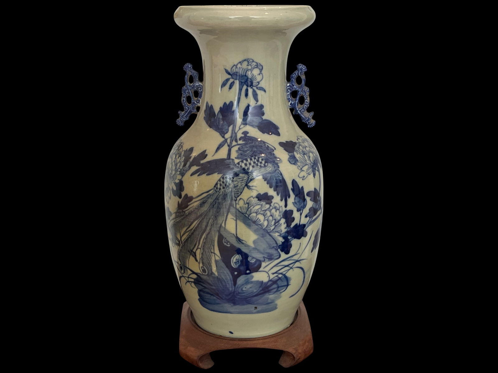 Chinese Blue and White Celadon-Ground Baluster Vase with Phoenix and Peony Decoration on Hardwood: This handsome Chinese baluster vase presents the appealing combination of pale celadon glazing with bold underglaze blue decoration that was produced in quantity during the Qing Dynasty for both domes
