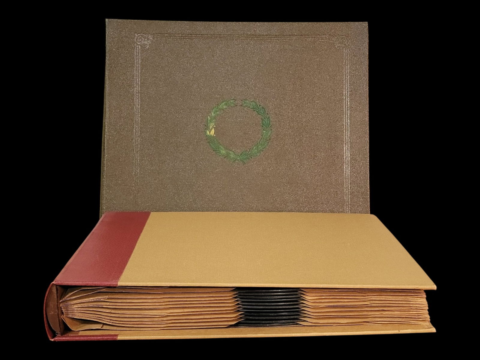 Vintage binder-style 78 rpm record album with numbered index sleeves, holding mixed-label 10-inch (1 of 8)