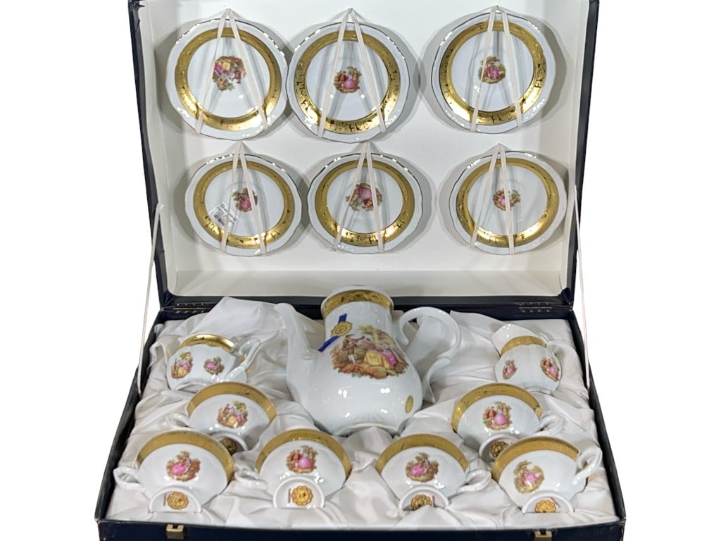 Italian 24KT Gilt-Decorated Porcelain Coffee Service with Rococo 'Courting Couple' Scenes, in Fitted: An Italian 24KT gilt-enhanced white porcelain coffee service, decorated throughout with Watteau-style Rococo courting scenes and encircled by broad, burnished gilt bands with tonal landscape and figur