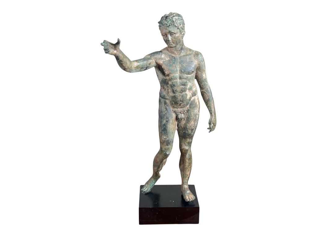 Classical-Style Bronze Nude Male Figure, Arm Outstretched, on Black Plinth Base, 26"H: A classical-style patinated bronze figure sculpture depicting a nude male in contrapposto, presented on a stepped black plinth base. The figure is modeled with an athletic torso and naturalistic muscu