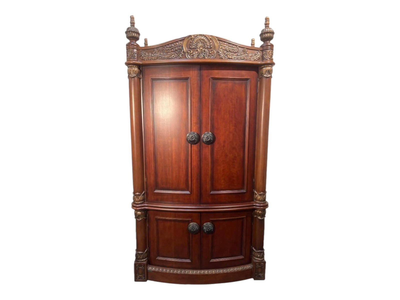 Stately Carved Mahogany Bow-Front Armoire with Palmette Crest and Fitted Interior: This imposing carved mahogany armoire combines the grandeur of classical European furniture design with a thoughtfully configured interior, standing nearly eight feet tall and crowned by a