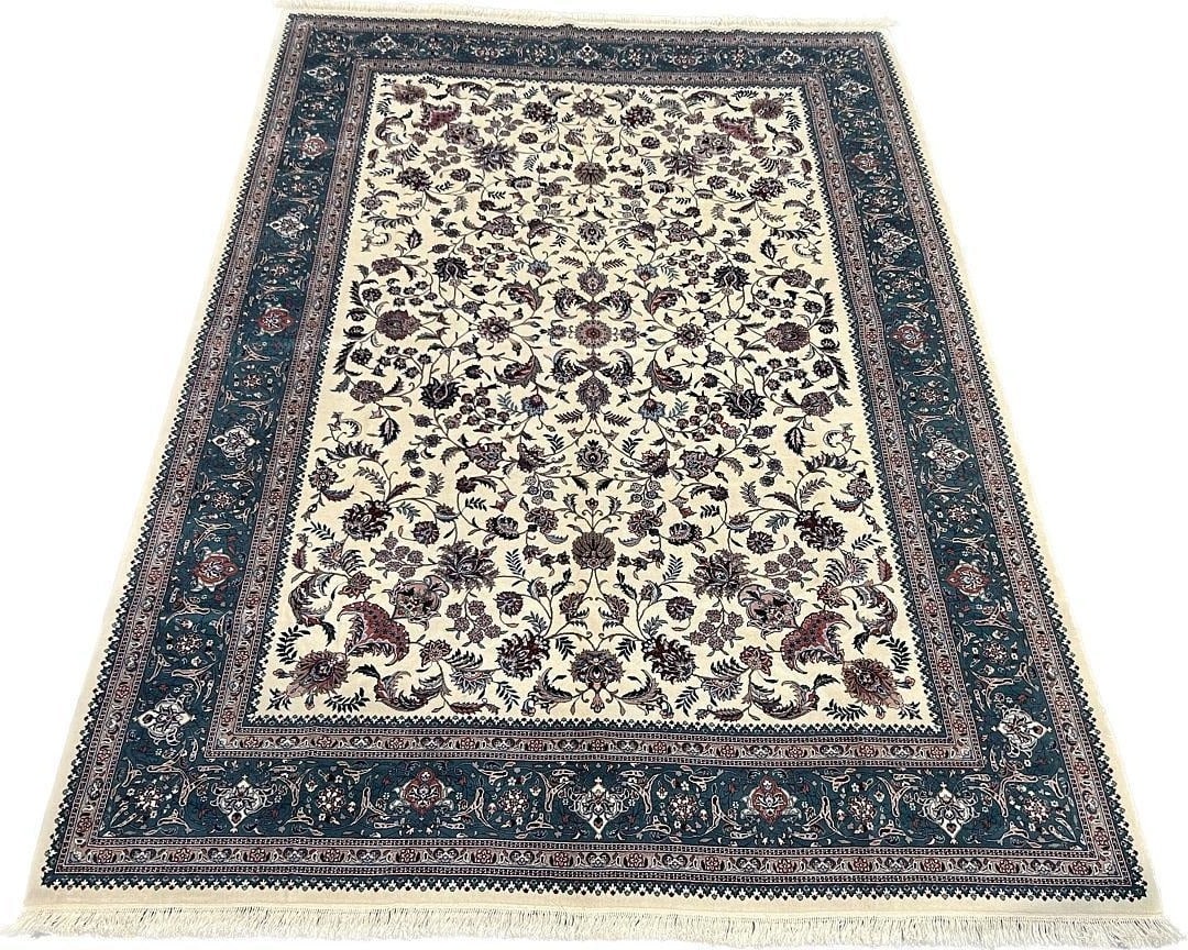 Kashan Design Hand-Knotted Wool and Silk Area Rug, 9'9" x 13'9": Kashan design hand-knotted rug with an ivory field and a deep blue border, filled with densely drawn floral vines, palmettes, and a balanced central medallion arrangement. The attached label